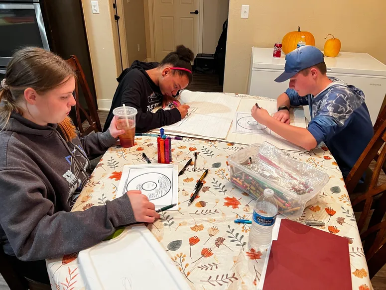 Group focused on creative drawing tasks