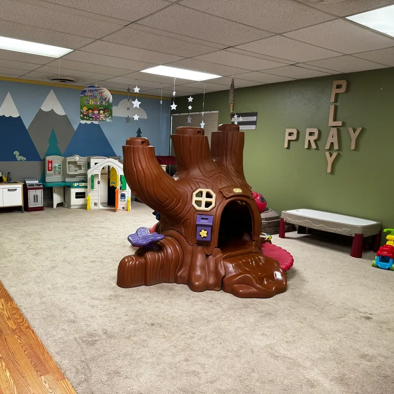 Kids' playroom featuring mountain wall mural